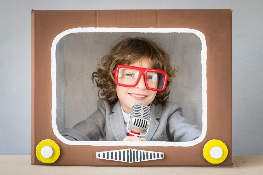 Child playing with cartoon TV