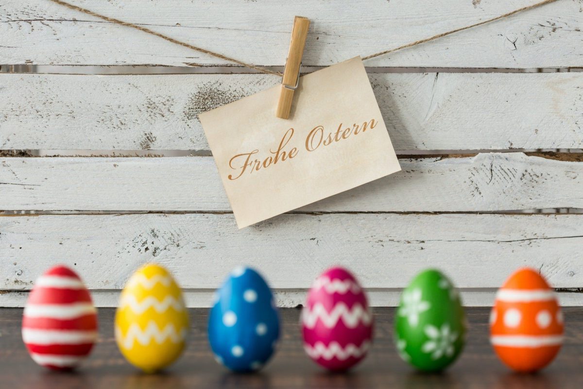 Easter eggs against wooden wall